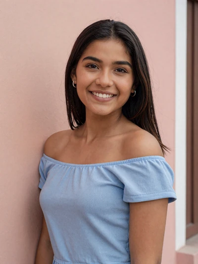 Claudia, 23, Salvadoran single from Santa Ana leaning against a pastel wall smiling brightly
